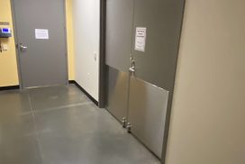 Copaken Brooks Plaza Colonnade Office Tower Hallway corner with large kick-plate on double doors.