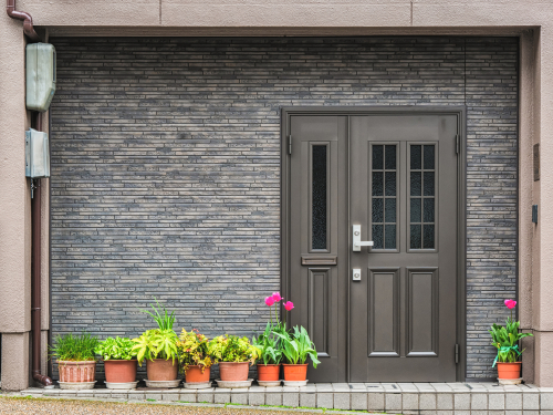 Front door painted with SW 7048 Urbane Bronze paint color.