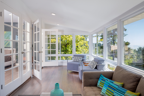 airy sunroom interior with large windows